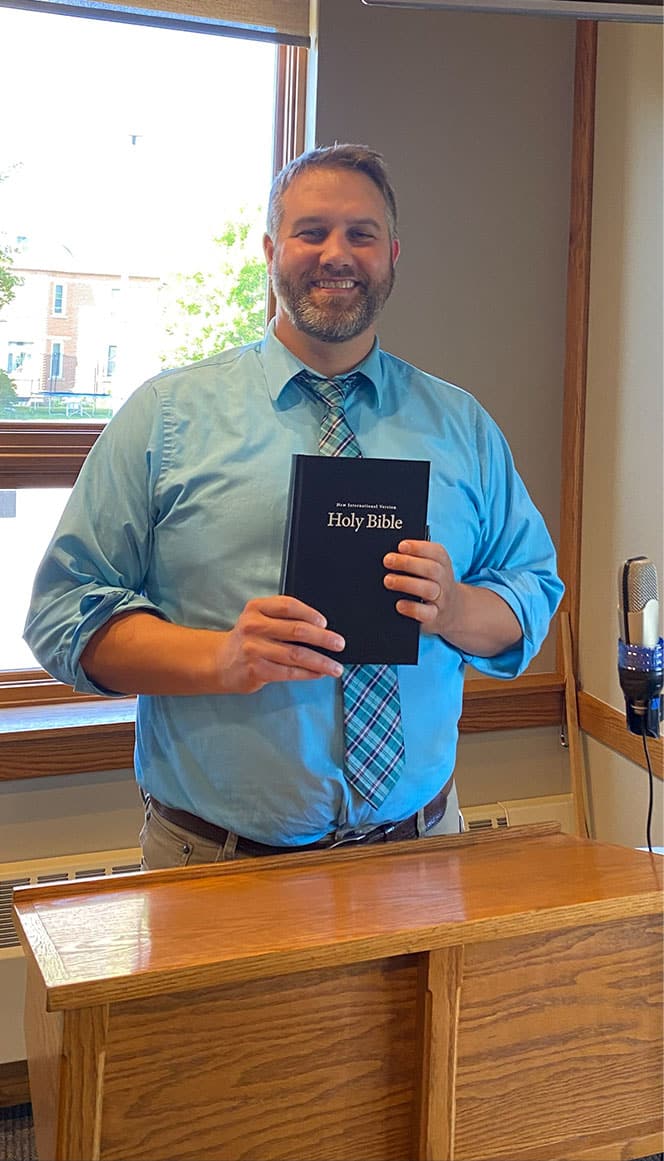 St. Pauls Pastor with Bible
