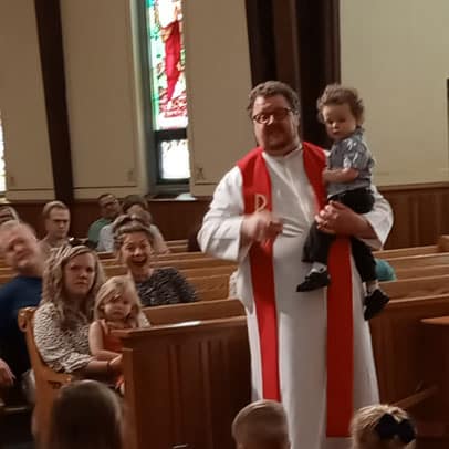 St. Pauls Pastor with Child